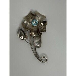Sterling by Jordan Crystal Accented Flower Brooch With Blue Stone